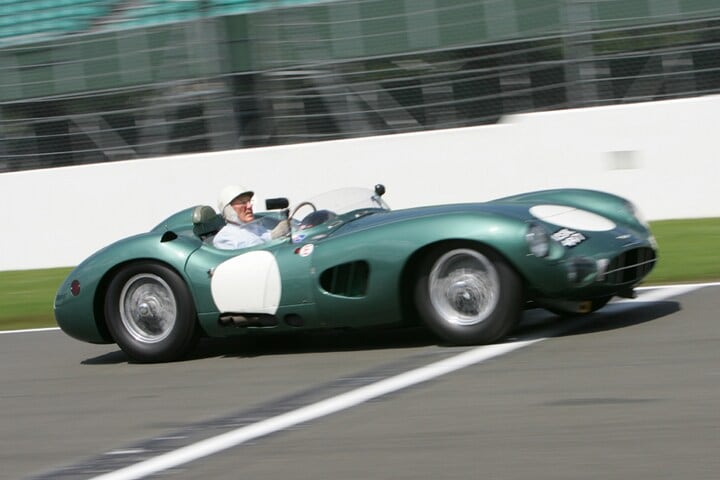 Sir Stirling Moss in Aston Martin