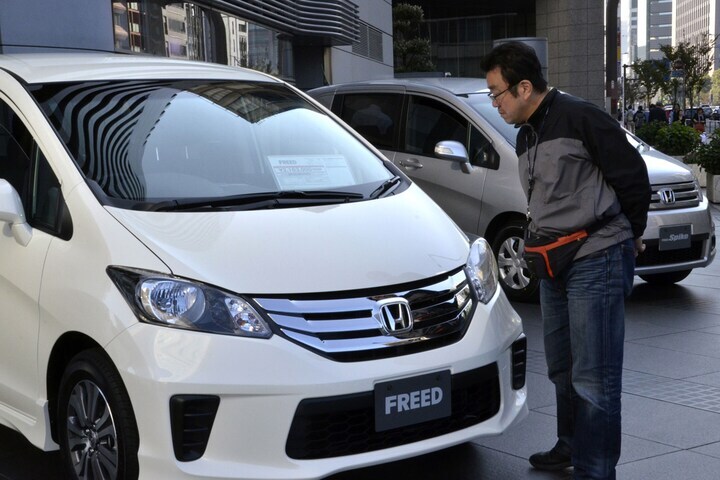 Honda-klant in Tokio | Foto: ANP/AFP