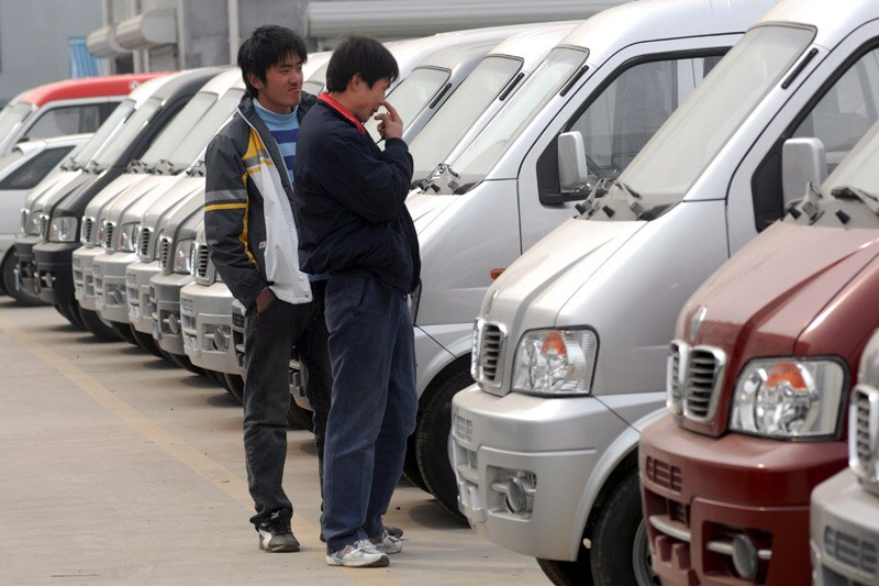 Autokopers in Qingdao city, China | Foto: ANP/EPA